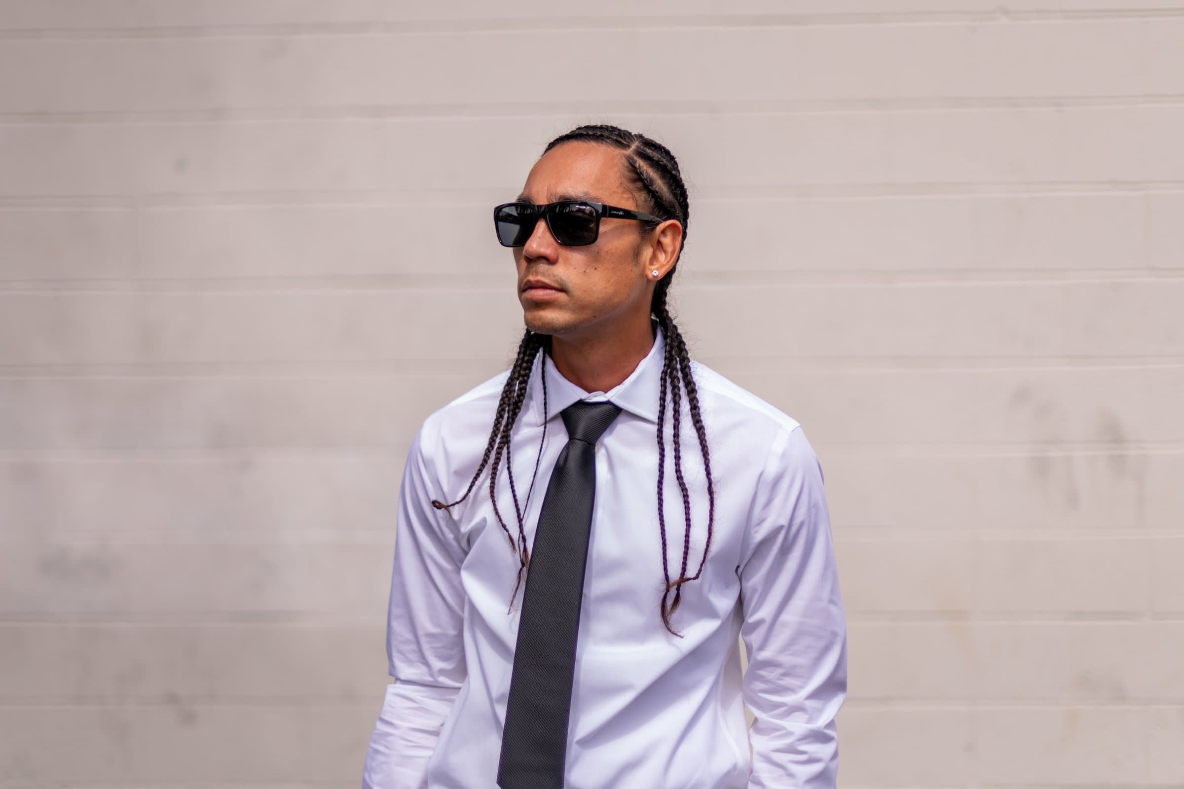 Kekoa in a white shirt and black tie